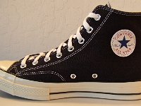 Chuck '70 Black High Tops  Inside patch view of a right Chuck '70 black high top.