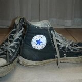 Trashed High Top Chucks  Partial front and inside patch views of well worn black high tops.