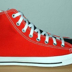 Red/Black 2-Tone High Top Chucks  Red and black right 2-tone high top, outside view.