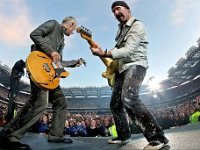 U2  The Edge and bassist Adam Clayton rock out to a sold out crowd.