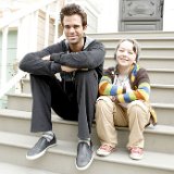 About a Boy  Marcus and Will seated on house steps.