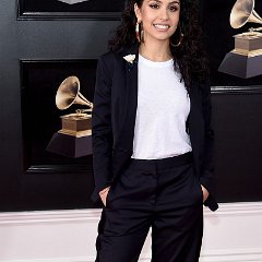 Alessia Cara  Alessia Cara attends the Grammy Awards in white chucks.