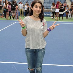Alessia Cara  Alessia Cara attends the U.S. Open in blue high top chucks that match the court