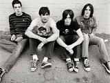 All American Rejects  The members sit against a wall, looking good in their chucks.