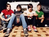 All American Rejects  All the members sit against the trunk of their car.