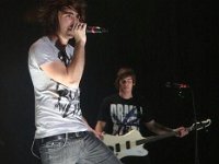 All Time Low  Alex Gaskarth wearing black chucks during a performance.