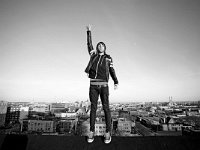 All Time Low  Alex Gaskarth on top of the world wearing black chucks.