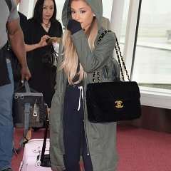 Ariana Grande  Ariana Grande spotted in the airport wearing white low cut chucks.