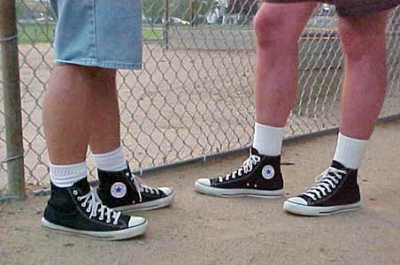 Wearing black high top chucks