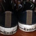 Brad Deniston Collection of Chucks  Rear view of black low cuts with olive trim.