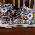 Brad Deniston Collection of Chucks  Inside patch views of comic print high tops with red shoelaces.