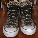 Brad Deniston Collection of Chucks  Front view of leopard print high tops.