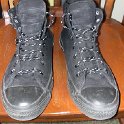 Brad Deniston Collection of Chucks  Front view of monochrome black  high top chucks.