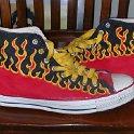 Brad Deniston Collection of Chucks  Outside views of painted red high top chucks.