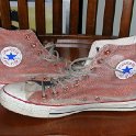 Brad Deniston Collection of Chucks  Side view of painted high tops.