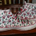 Brad Deniston Collection of Chucks  Outside views of Santa print high top chucks.