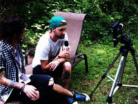 Breathe Carolina  Tommy Cooperman speaks in an interview in black low tops with blue laces.