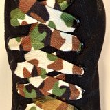 Camouflage Print Shoelaces On Chucks  Desert camouflage print shoelaces on monochrome black high top chucks.