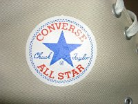 Cargo High Top Chucks  Close up of the Chuck Taylor logo side patch from a khaki cargo high top.