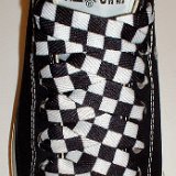 Black and White Checkered Shoelaces on Chucks  Black low top chuck with black and white checkered shoelaces.