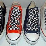 Black and White Checkered Shoelaces on Chucks  Core low top chucks with black and white checkered shoelaces.