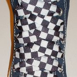 Black and White Checkered Shoelaces on Chucks  Navy blue high top with black and white checkered shoelaces.
