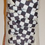 Black and White Checkered Shoelaces on Chucks  Optical white high top with black and white checkered shoelaces.