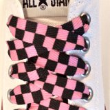 Black and Pink Checkered Shoelaces on Chucks  Optical white low top chuck with black and pink checkered shoelaces.