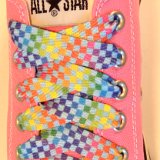 Rainbow Checkered Print Shoelaces On Chucks  Rainbow checkered print shoelace on a pink low top chuck.