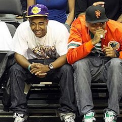 Chris Brown  Chris Brown wearing green low cut chucks while sitting with fellow R&B singer Omarion, who is also wearing black low cut chucks.
