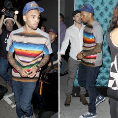 Chris Brown  Chris Brown wearing blue high top chucks to match his Pittsburgh hat.