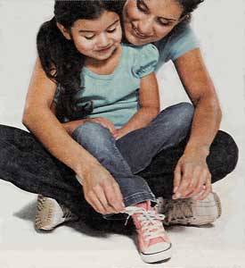mom helping girl lace up pink high top chucks