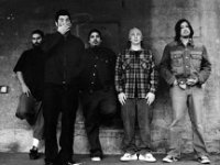 The Deftones  The band in front of a wall.