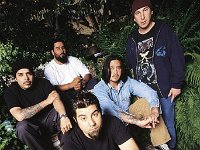 The Deftones  Posed shot of the band in a garden.