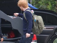 Ed Sheeran  Ed Sheeran unloading his guitar.