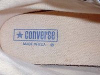 Evolution of the Insole  Close up view of the inner sole, inner canvas, and heel support of a 1970s navy blue high top.