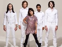 Flyleaf  Posed shot of the band wearing all white. Jared Hartmann is wearing optical white chucks.