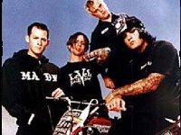 Good Charlotte  Good Charlotte members pose for a band picture on a dirt bike.