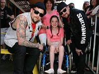 Good Charlotte  Posing with a fan.