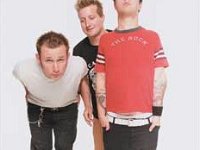 Green Day  Tre Cool and Billie Joe Armstrong sporting black high top and low cut chucks.