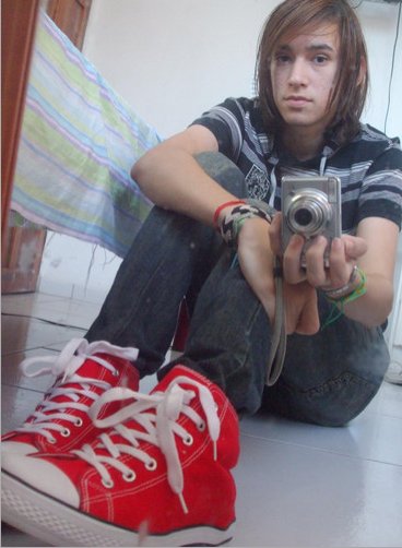 girl wearing red converse high tops