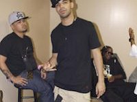 Hip-Hop musicians wearing chucks.  Drake showing off his chucks.