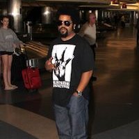 Ice Cube  Ice Cube at the airport wearing black chucks.