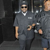 Ice Cube  Ice Cube wears black chucks to match his all black outfit.
