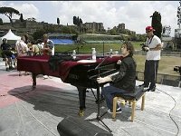 Josh Groban  Josh Groban performing seated at a piano.