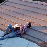 Joshua Bassett  Joshua lying on a roof playing and singing, shot 2.