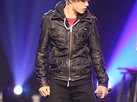 Justin Bieber  Justin wearing black high top chucks.