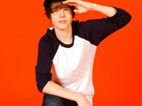 Justin Bieber  Justin Bieber wearing red high top chucks.