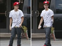 Justin Bieber  Justin Bieber wearing red high top chucks.