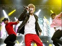 Justin Bieber  Justin Bieber wearing black high top chucks in performance.